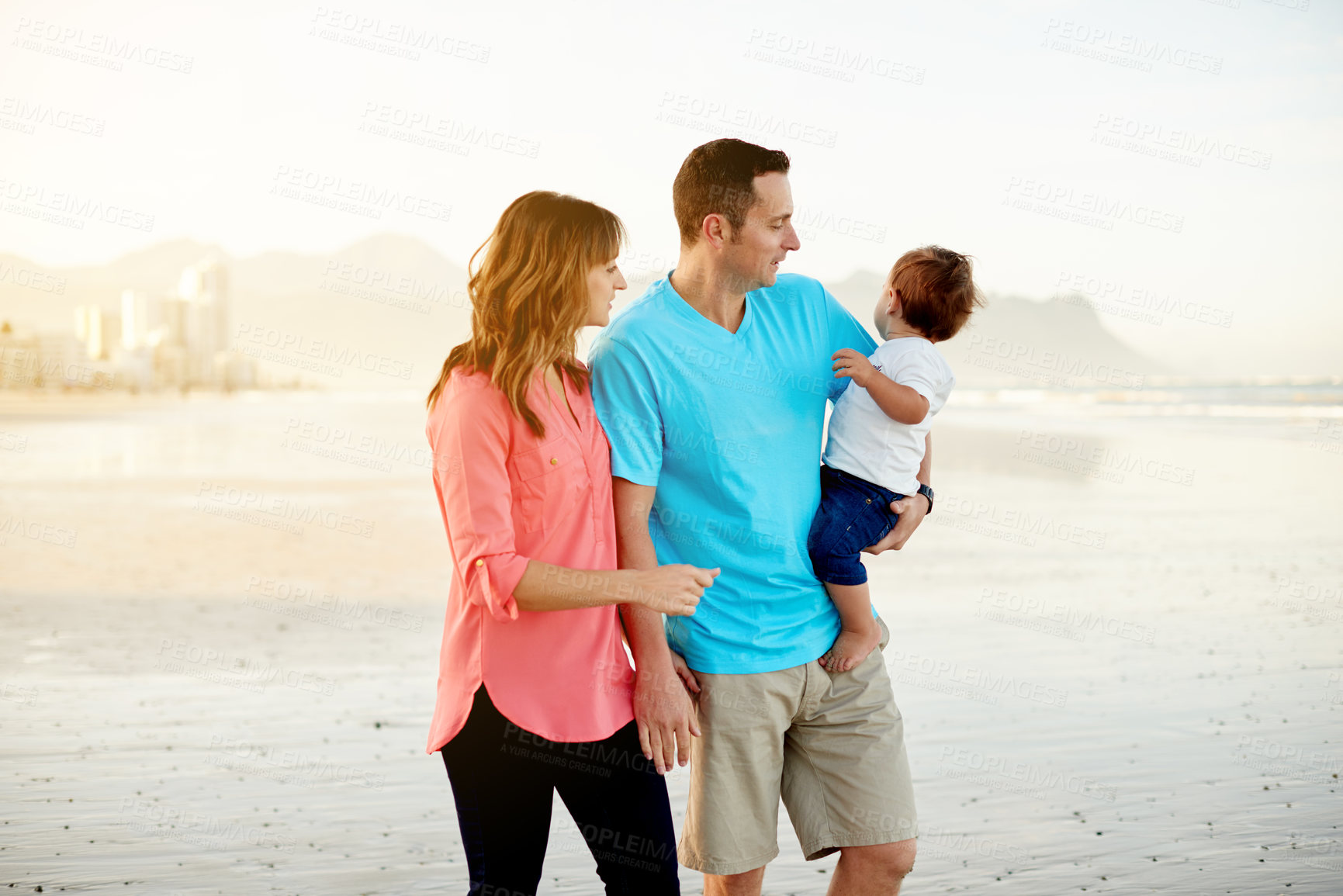 Buy stock photo Travel, parents and walking with baby on beach for holiday adventure, bonding together or trust. Love, family and stroll with boy child on seashore for vacation, weekend break or relationship support