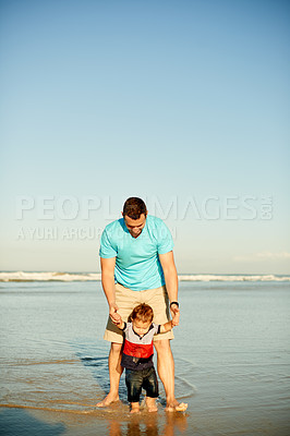 Buy stock photo Dad, beach and playing with child in water for holiday, weekend getaway or childhoood in nature. Father, son or holding hands with kid on ocean coast or mockup space for outdoor bonding together