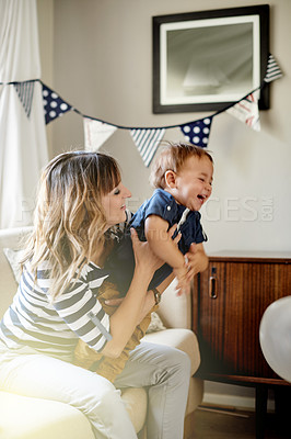 Buy stock photo Happy mom, sofa and playing with toddler for bonding, laughing or family time together in home. Mother, boy or playful child with smile or embrace on couch for love, support or childhood in house