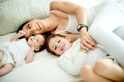 Buy stock photo Home, mother and kids in bedroom, smile and bonding together with siblings. Apartment, single parent and family with portrait, children and mama with weekend break, relax and rest with happiness