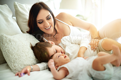 Buy stock photo Mother, happy and children in bedroom with care, love and bonding together for connection. Woman, son and daughter at home with trust, smile embrace and affectionate for special family memory.