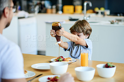 Buy stock photo Child, father and maple syrup in kitchen with breakfast, meal prep or excited for bonding. Happiness, boy or man in home with food, snack or hungry in morning for growth and development in childhood