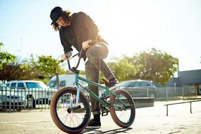 Buy stock photo Man, cyclist and bicycle for outdoor hobby, activity or challenge in skate park. Bike, person and urban sport for cycling, BMX training and skills for competition with balance and stunt exercise