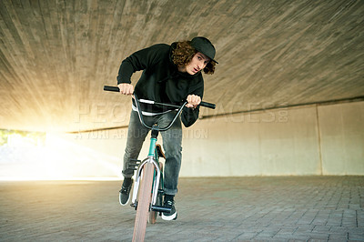 Buy stock photo BMX, ride and underground with man on bike for activity, adrenaline hobby or extreme sports training. Exercise, risk and speed with person on bicycle in urban park for action, cycling or energy