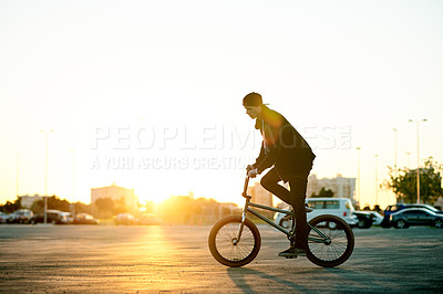 Buy stock photo Balance, BMX and ride with man on bike in city for activity, adrenaline hobby or sports training. Exercise, flare and risk with extreme person on bicycle on street for action, cycling or energy