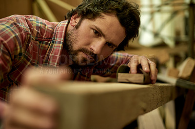 Buy stock photo Carpenter, workshop and man with timber for sanding, furniture restoration and renovation. DIY project, factory and handyman with plank, lumber or manufacturing for artisan craft or production
