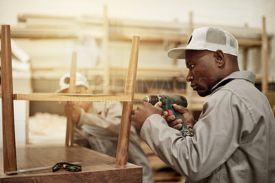 Buy stock photo Drill, handyman and person in workshop with woodwork, furniture restoration and building project. Tools, carpenter or black man in factory for cabinet making, manufacturing or industrial production.