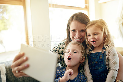 Buy stock photo Woman, children and tablet on sofa with selfie, love and together for video, cartoons and relax in home. Mother, girls and digital tech for social media, games or movies in living room of house