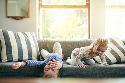 Buy stock photo Relax, playful and smile with children on sofa for bonding, support and sibling games together. Happiness, love and trust with kids or sisters in living room of family home for weekend break