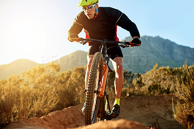 Buy stock photo Mountain bike, sports and man with fitness, energy and environment with challenge. Person, adrenaline and cyclist with practice, competition or hobby with adventure, journey or nature with dirt road