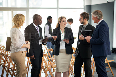 Buy stock photo Business woman, tablet and networking at conference with group, introduction or discussion at meeting. People, professional chat and tech with app, smile or communication at international convention