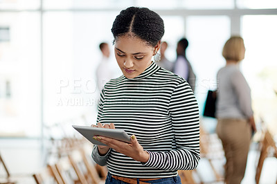 Buy stock photo Creative, woman and typing with tablet in office for research, editor feedback and proofreading. Journalist, digital and review for fact check, editing article and update draft for publication agency