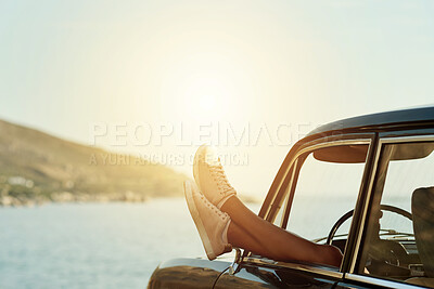 Buy stock photo Feet, window and road trip with car at beach with vacation, travel or relax on getaway journey. Legs, shoes and rest on break, ocean view and vehicle for transportation, sky or space with flare