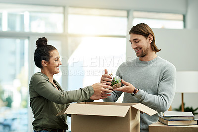 Buy stock photo New home, help and couple with box for moving to house, property mortgage and real estate purchase. Homeowner, plant and happy man and woman for relocation, rental apartment and packing furniture