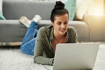 Buy stock photo Laptop, lounge and happy woman relax on floor for blog, online search or reading email. Computer, internet and girl on carpet in home for browsing website, social media or check news with flare