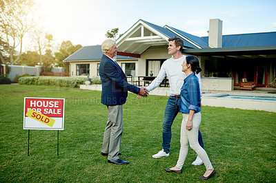 Buy stock photo Property, realtor handshake and homeowner couple with sold sign, deal and new house for milestone together. Agreement, mortgage and investment with man, woman and purchase for home ownership success