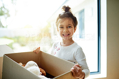 Buy stock photo Box, portrait and smile of girl in new home on moving day, excited for child development or growth. Happy, property and real estate with cute kid carrying package in apartment for relocation