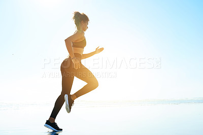 Buy stock photo Fitness, woman and running by ocean for training, body wellness and health with space. Beach, runner and cardio exercise outdoor for endurance challenge, workout and energy with flare in nature
