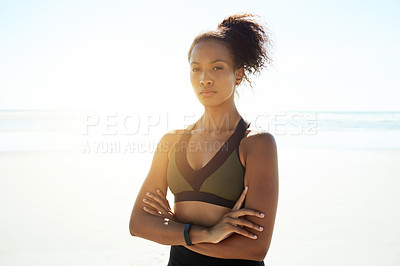 Buy stock photo Portrait, fitness and woman at beach with arms crossed for determination, confidence and flare. Sports, serious athlete and runner at sea outdoor for exercise, health or wellness with space in Brazil