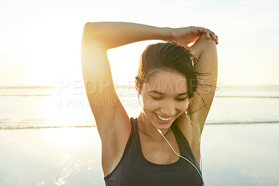 Buy stock photo Beach, music or happy woman stretching for fitness, healthy body or wellness at sunset. Warm up arms, earphones or athlete outdoor to prepare for exercise, training or ready for sports workout at sea