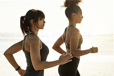 Buy stock photo Cardio fitness, women and running on beach for marathon practice, exercise challenge or endurance. Teamwork, people or jog in nature for resistance training, physical activity and sports performance