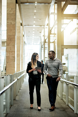 Buy stock photo Business people, tablet and meeting in hallway for planning, agenda or feedback for project. Proposal, tech and admin team in office for review, schedule update or support for company development