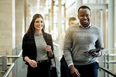 Buy stock photo Businessman, tablet and woman at office building for property investment, tour or happy for deal. Person, smile and portrait with client, excited or proposal for real estate in hallway with developer