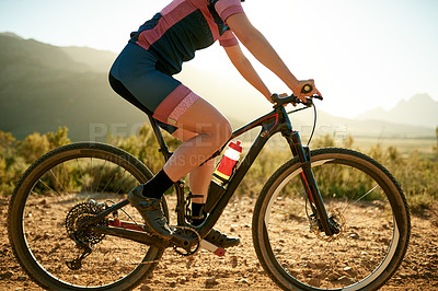 Buy stock photo Cycling, legs and travel with woman in nature for cardio challenge, training and health. Exercise, sports athlete and bicycle with person outdoor for triathlon practice, wellness and workout