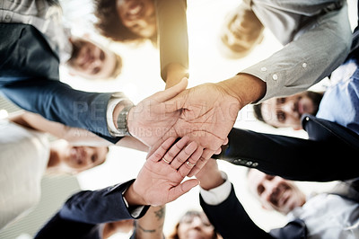 Buy stock photo Business people, team building and stack hands below in office for support, synergy and cooperation. Group, workers and pile together for collaboration at work, motivation and community with mission