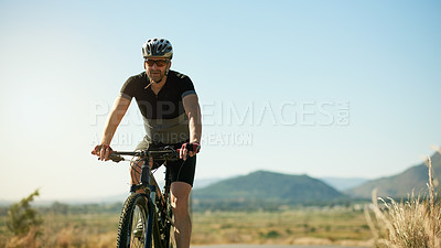 Buy stock photo Man, cyclist and blue sky with bicycle in nature for mountain ride, exercise or outdoor workout. Active, male person or biker with helmet on bike for fitness, race or cycle marathon on mockup space