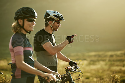Buy stock photo Pointing, fitness and bicycle with couple in nature for triathlon training, sports athlete or team. Cardio workout, cycling partner and resting stop with man and woman outdoor for exercise and space