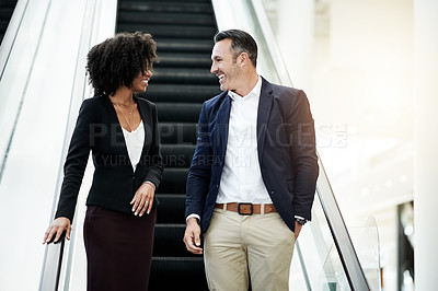 Buy stock photo Business, people and talking on escalator in office for corporate growth, planning and discussion. Collaboration, mentor and intern with conversation on moving stairs for career development and chat