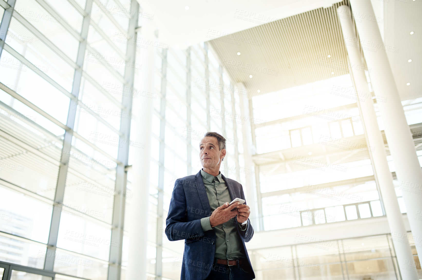 Buy stock photo Thinking, business and man with phone in office for vision, research and architecture design. Mature architect, mobile and below with building planning, development reflection and quality assurance