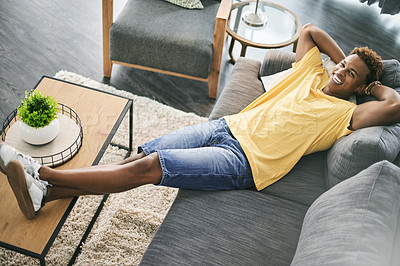 Buy stock photo Relax, above and portrait of black man on sofa for chilling, rest and comfortable on weekend. Happy, home and person laying on couch for break, calm and free time with smile, wellness and peace