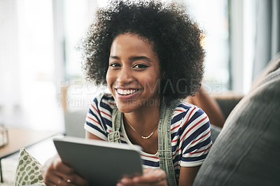 Buy stock photo African girl, tablet and smile on couch, relax and portrait with streaming, film or ebook in home. Happy woman, tech and chill on sofa, laying and application for movie subscription on web in Kenya