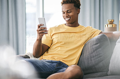 Buy stock photo Happy, sofa and African man with phone for online chatting, social media and message notification. Home, weekend and person on smartphone relax for connection, internet and networking on mobile app