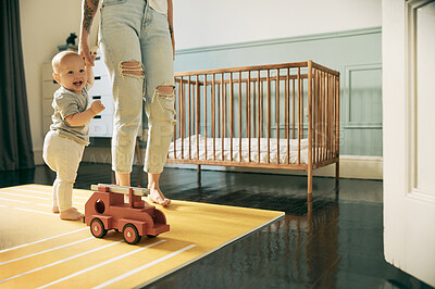 Buy stock photo Mother, baby and learning to walk while holding hands in home, bonding and education. Development, happiness and care of mama teaching child, kid or newborn walking, balance and first steps in house.