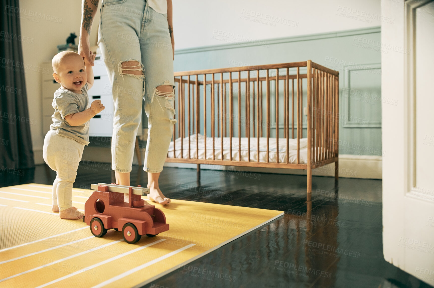 Buy stock photo Mother, baby and learning to walk while holding hands in home, bonding and education. Development, happiness and care of mama teaching child, kid or newborn walking, balance and first steps in house.