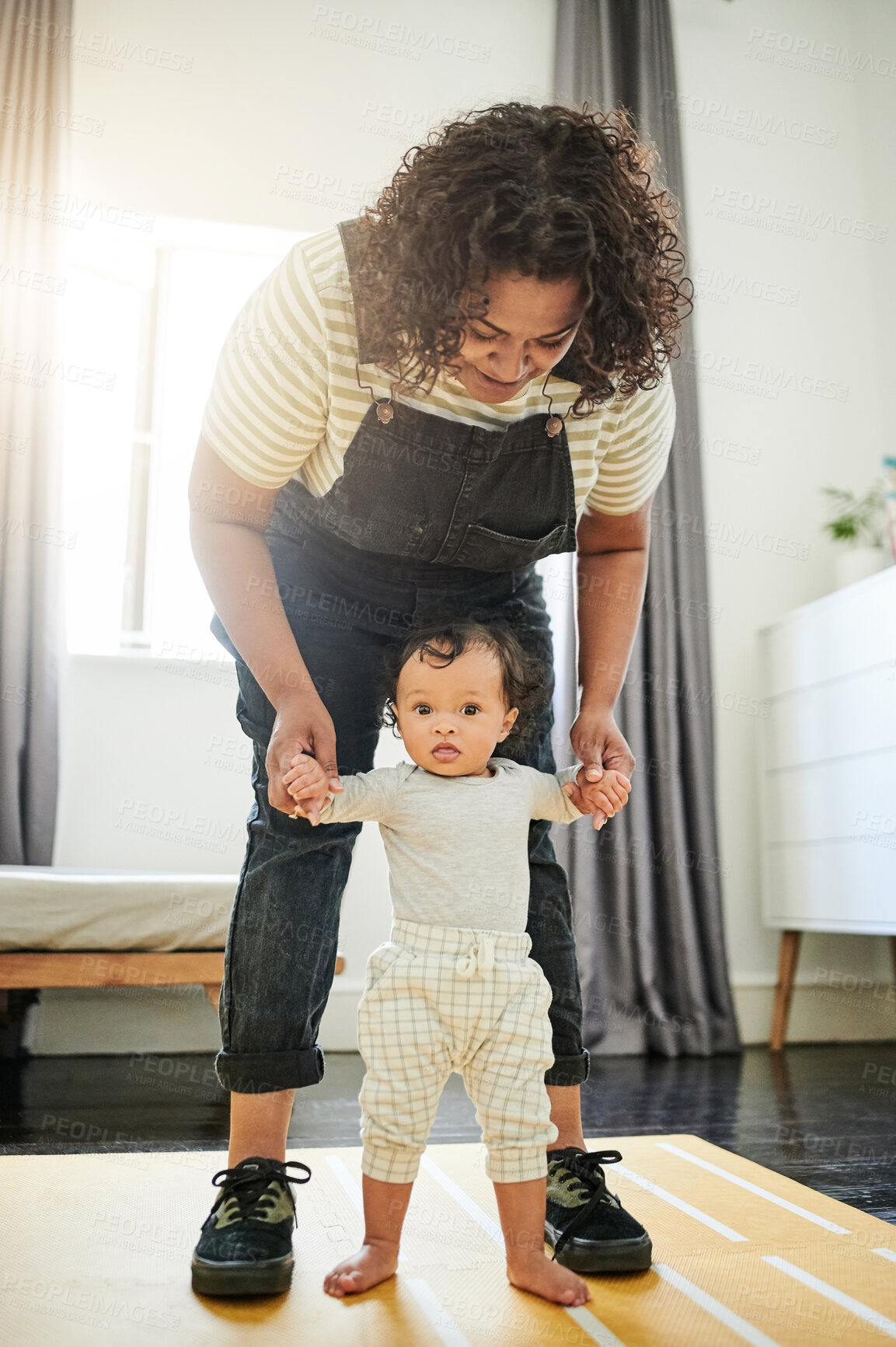 Buy stock photo Mother, baby and learning to walk holding hands in home, education and bonding. Care, development and portrait of mama teaching kid, toddler or newborn, helping and walking, support and first steps.