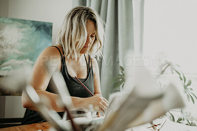 Buy stock photo Home art, paint brush and woman drawing creative sketch, graphic artwork or illustration in studio workshop. Passion, hobby and female artist, painter or designer create painting, picture or design