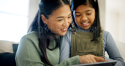 Buy stock photo Mother, child and happy with tablet in home for fun drawing app, bonding activity and development. Asian family, mom and girl kid with tech on sofa for online art puzzle, digital gaming or connection