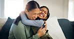 Child, mother and hug in home with care, love and happiness for connection together with daughter. Girl, mom and embrace on sofa for trust, support or excited parent  with Asian family reunion