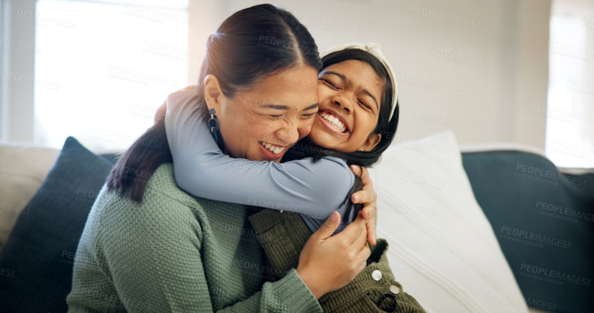 Buy stock photo Child, mother and hug in home with care, love and happiness for connection together with daughter. Girl, mom and embrace on sofa for trust, support or excited parent  with Asian family reunion