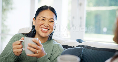 Buy stock photo Woman, laughing and friends with coffee in house, bonding together and conversation in living room. Asian person, talking and listening to gossip in lounge, happy and discussion with beverage in home