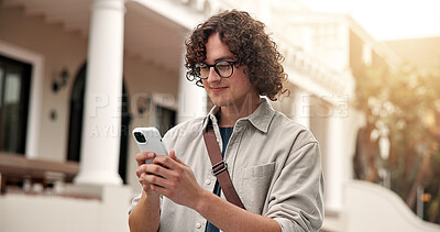 Buy stock photo Man, student and reading at campus with phone, test results and acceptance email for new semester. Smile, male person and mobile at university for enrollment, scholarship update and exchange program
