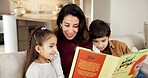 Happy, mom and reading book in home with children, education and learning with fairytale literature. Woman, kids and discussion on couch with fiction novel, storytelling and language development.