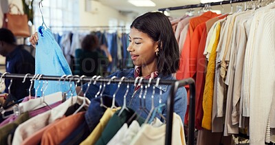 Buy stock photo Shopping, choice or woman in store with clothing rack, outfit search or decision in trendy style. Retail, option or person in boutique with apparel, garment check or selection for fashion purchase.