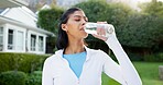 Break, water and woman outdoor with fitness, training pause and recovery with wellness activity. Hydration, cool down and person with bottle, workout rest and refreshing stop in backyard exercise.
