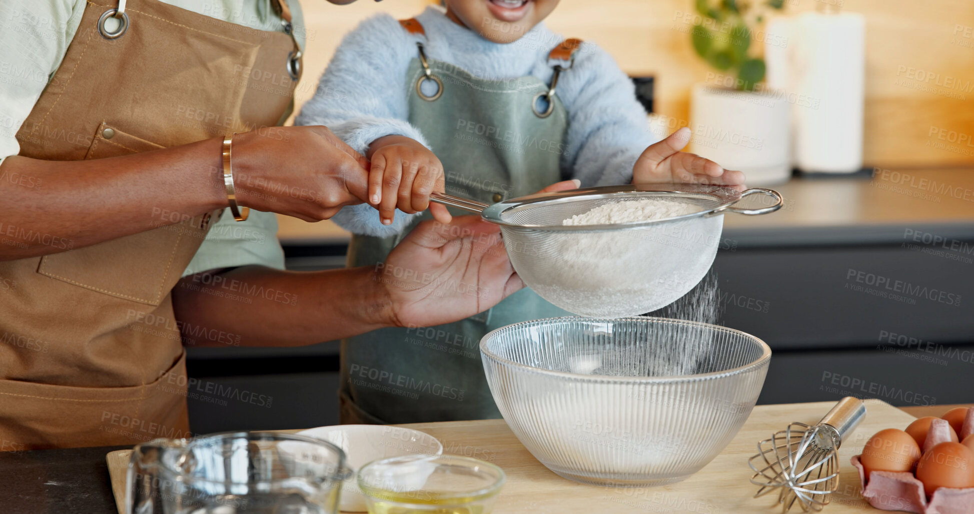Buy stock photo Mother, child and hands with sieve for baking together, teaching daughter and support in kitchen. Family, parent and girl flour sifting at home for learning, culinary skill development and help