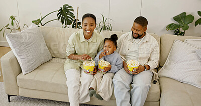 Buy stock photo Child, parents and watching tv with popcorn in home for entertainment or online streaming on sofa. Mom, dad or kid eating snacks with daughter for movie, subscription or network service in high angle